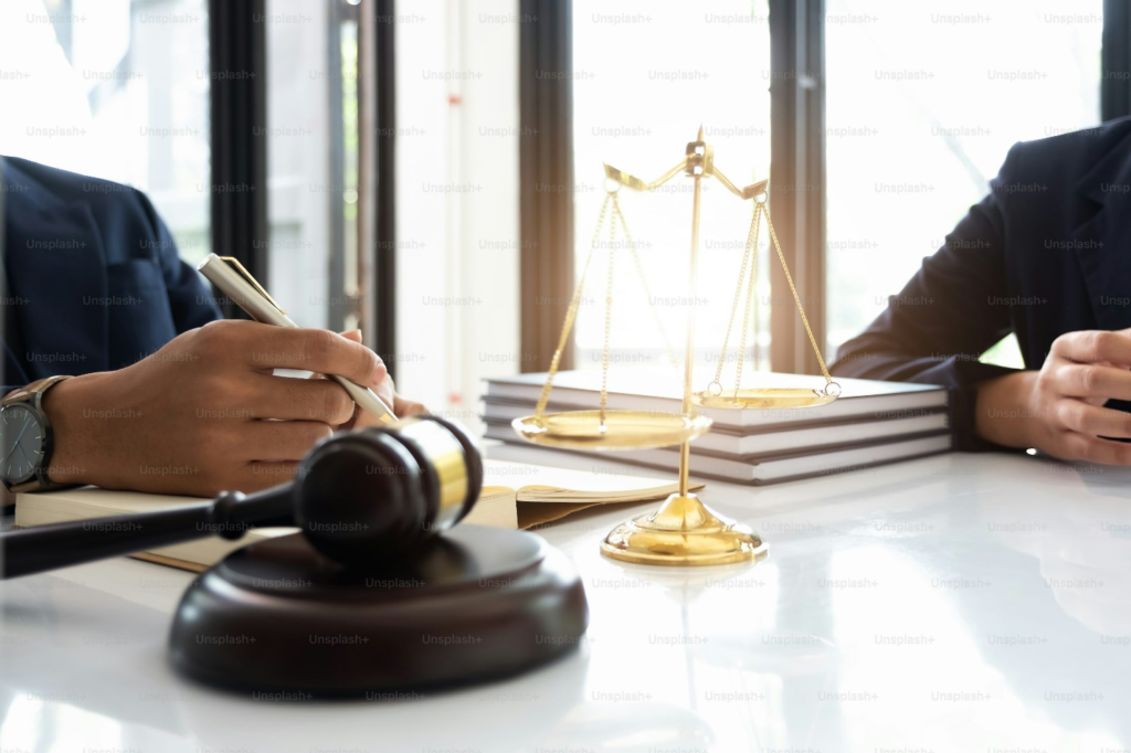 Gavel with the justice scale on the table.