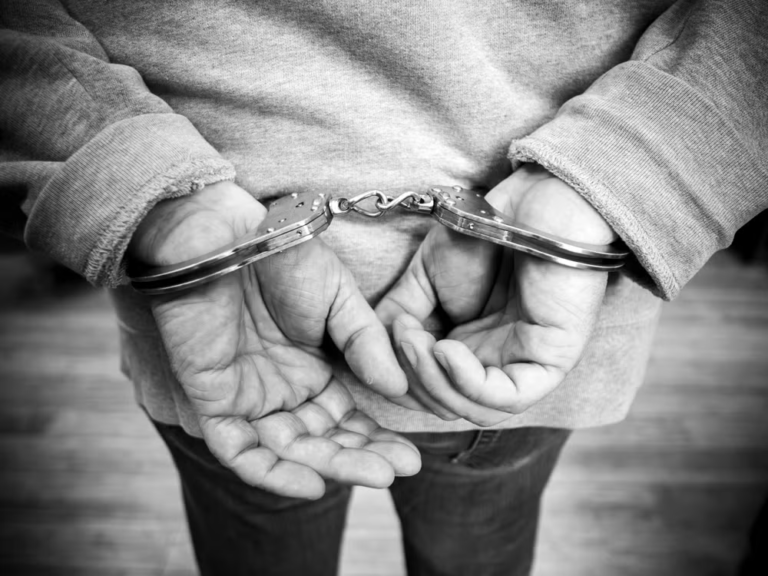 An image of a person in handcuffs