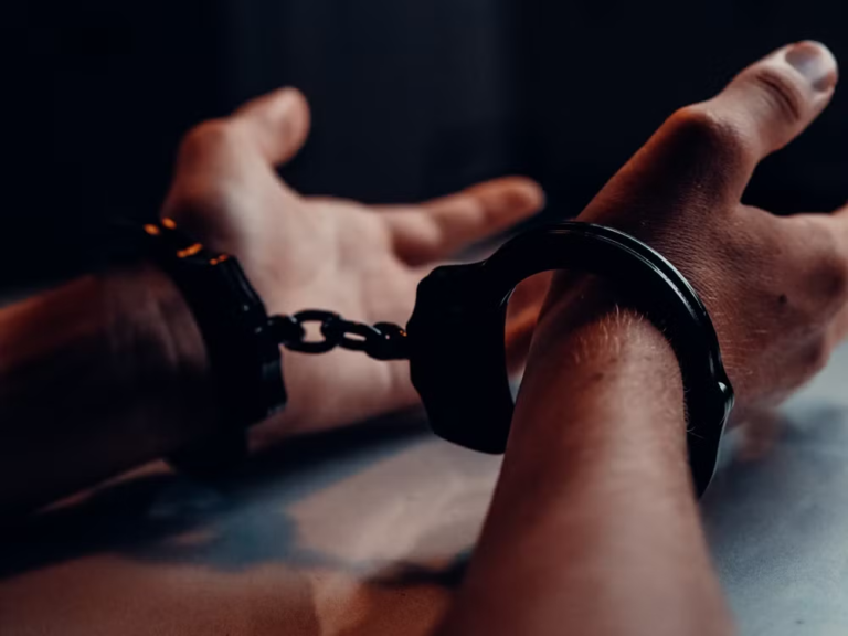 An image of a person in handcuffs
