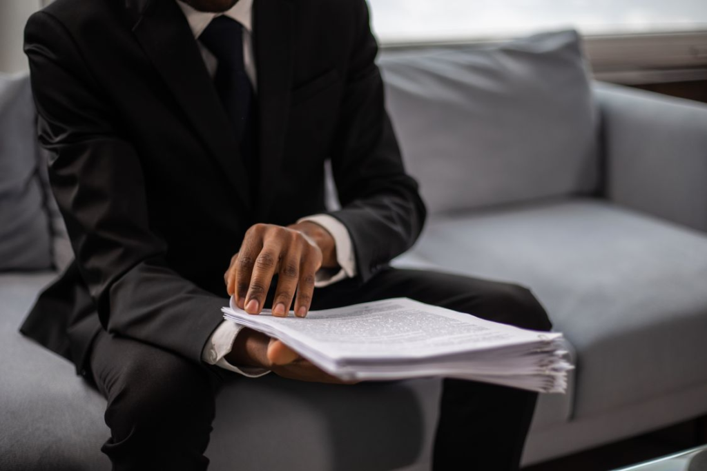 An image of a person looking through bail paperwork