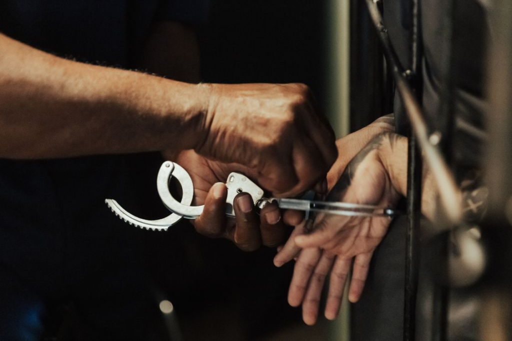 An image of a person in handcuffs