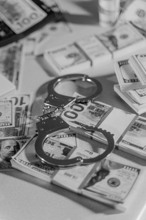 An image of handcuffs and cash