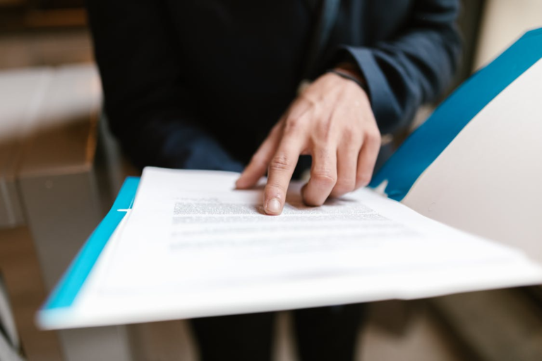 An image of a person reading a file